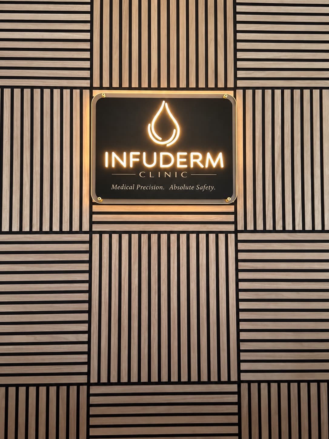 Illuminated INFUDERM Clinic sign