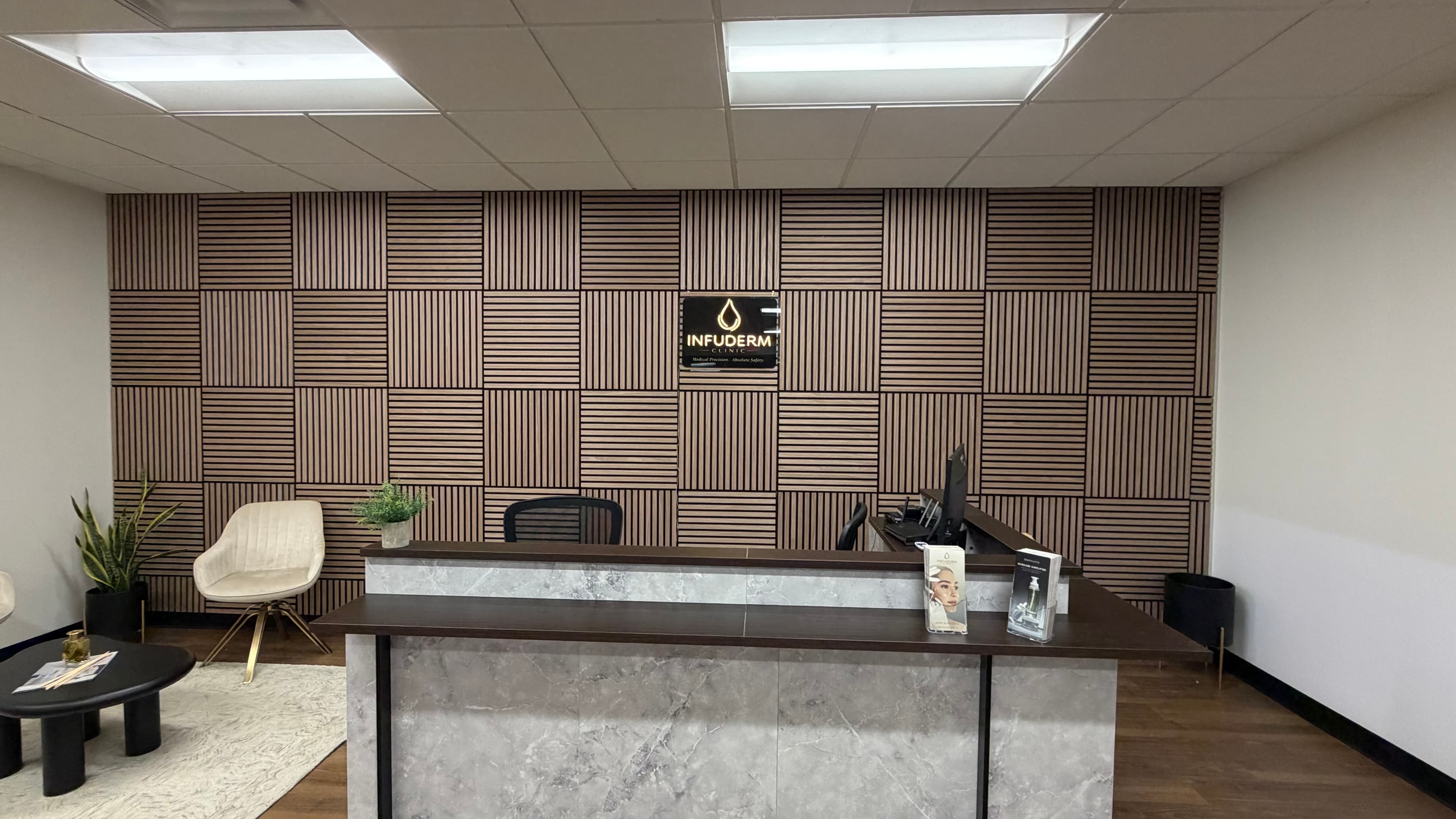INFUDERM New Jersey reception desk and branded feature wall