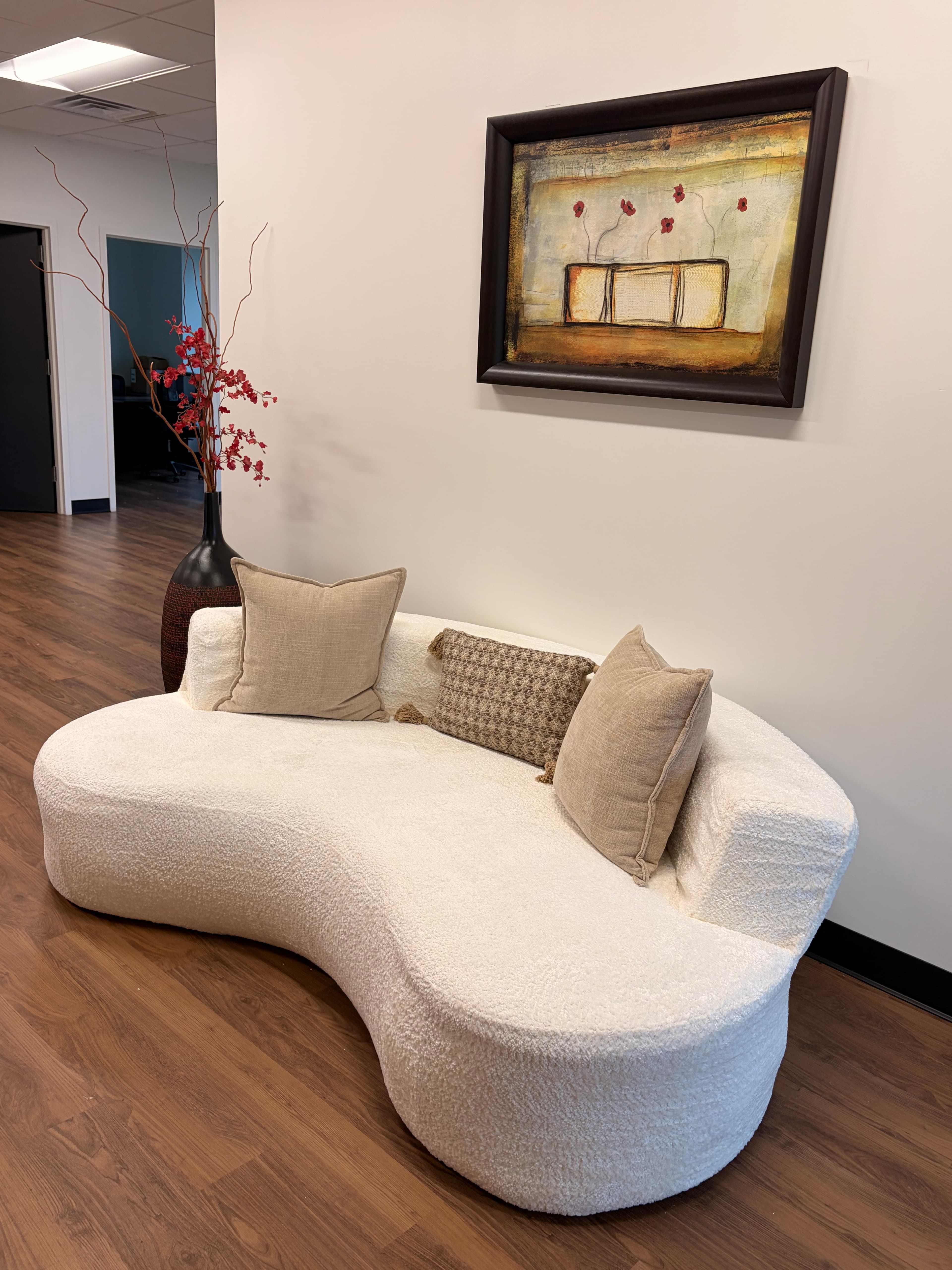 Sculptural white sofa in the INFUDERM New Jersey waiting area